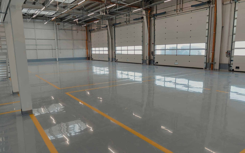 Finished industrial facility with coated flooring