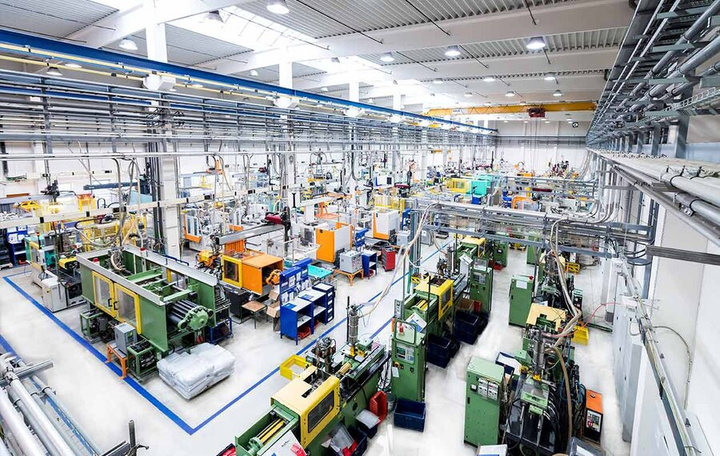 Industrial production hall with machinery under maintenance